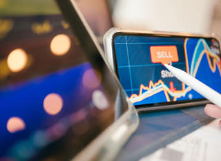 Trader working across markets while reviewing Bitcoin, Ethereum, and forex options